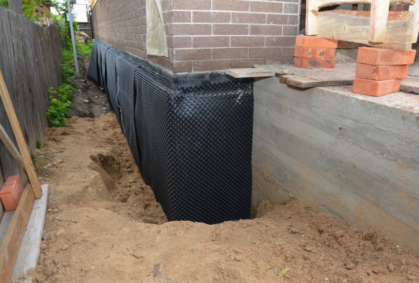 SJ Waterproofing Pros technician performing targeted Emergency Waterproofing assessment in Taylor, PA
